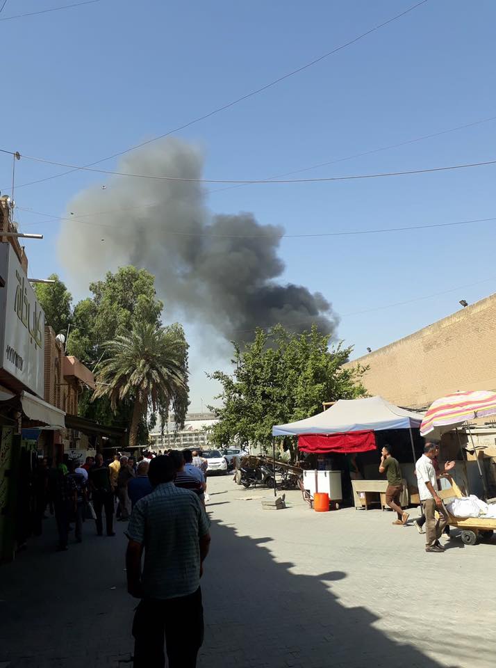 Photo posted on social media showing a black smoke rising from the site of the explosion in Baghdad, Iraq, May 30, 2017.